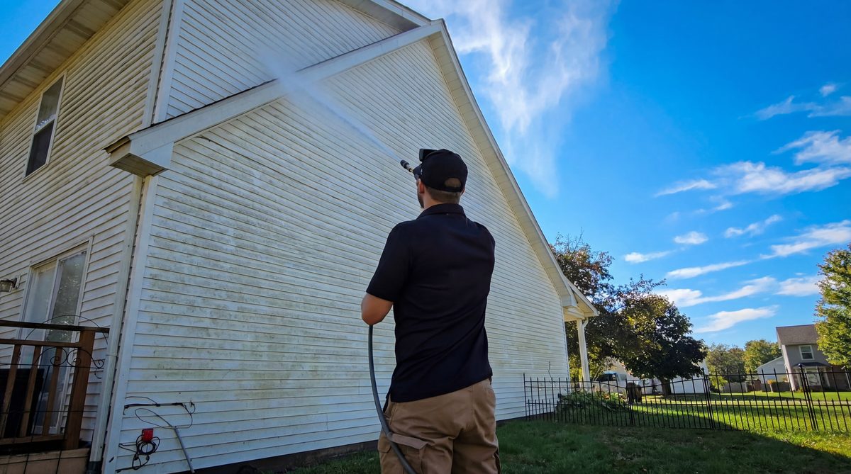 Before and after pressure washing results on a home in Evansville, IN